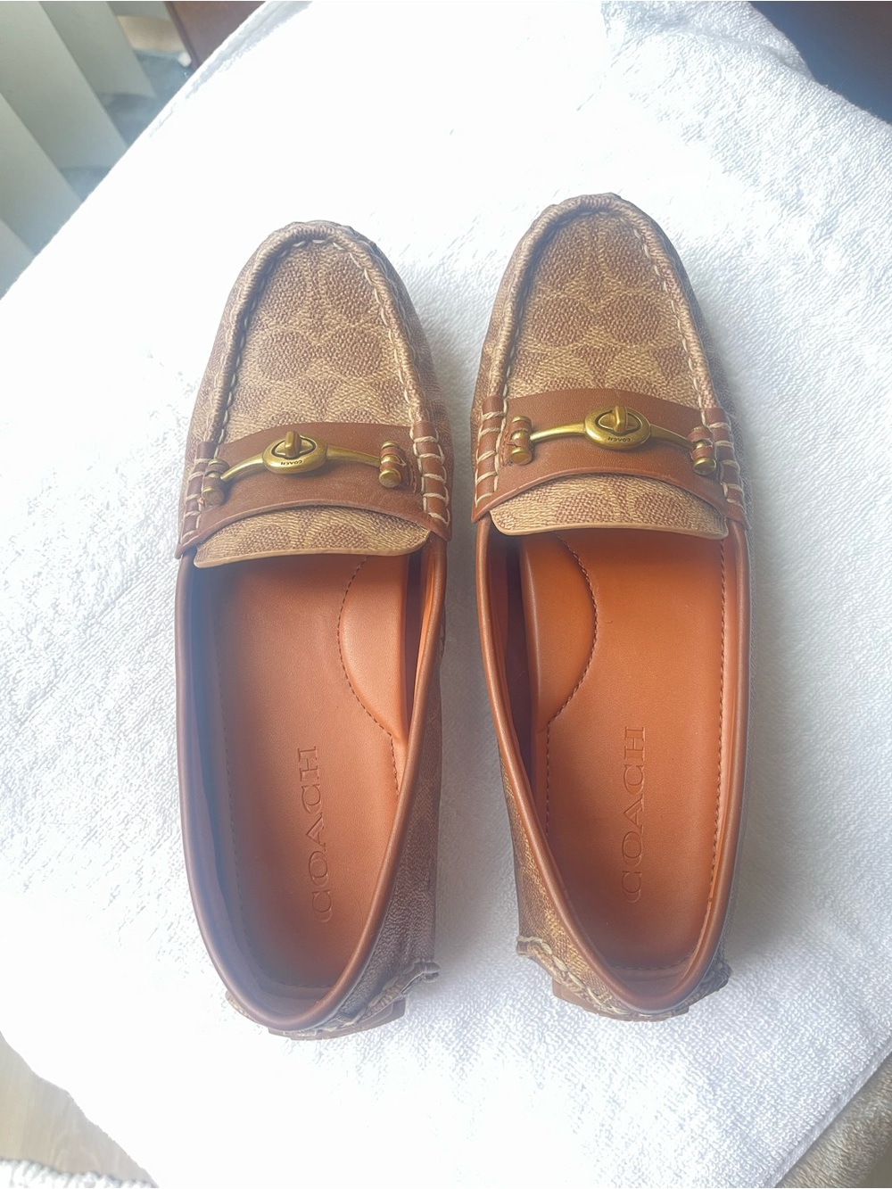 Women’s Coach flats.